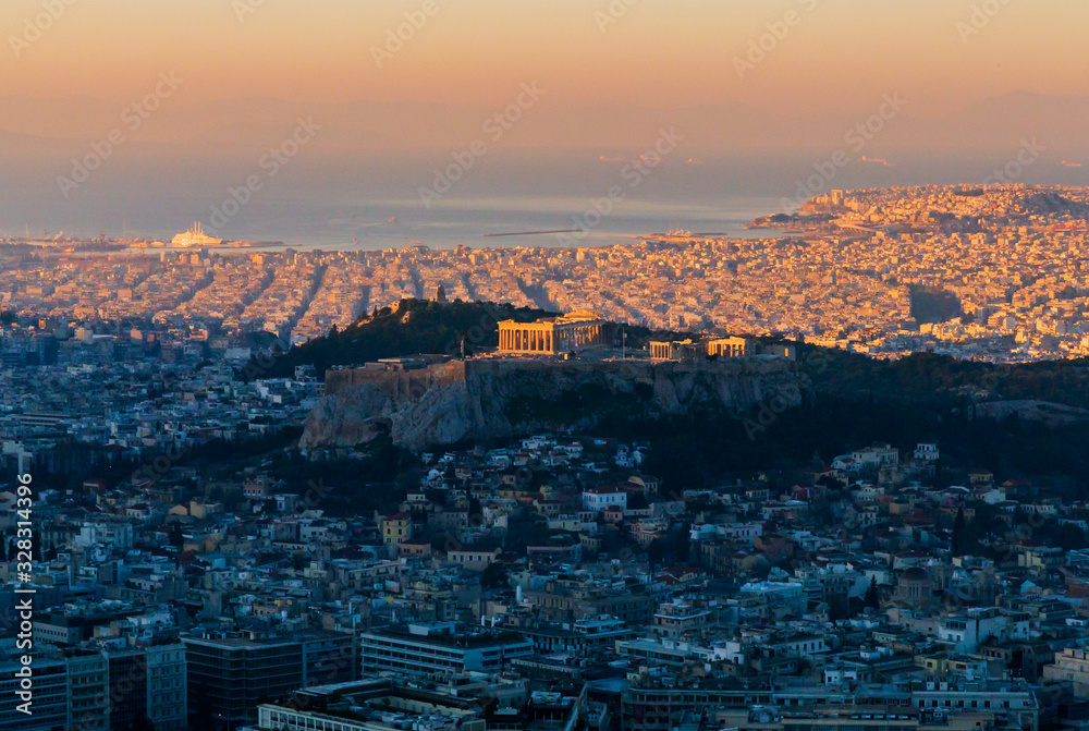 ATHENS, GREECE, December 22, 2013: Parthenon and Acropolis at dawn at different heights of the sun, the sun rises and illuminates the Parthenon more and more, an editorial.