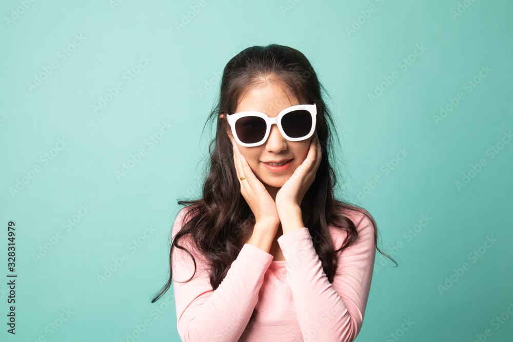 Portrait of a beautiful young asian girl in sunglasses.