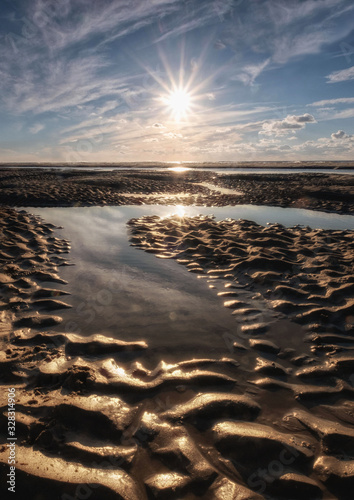 Tranquil colorful sunset over sea  viewed from the dutch coast. The Netherlands