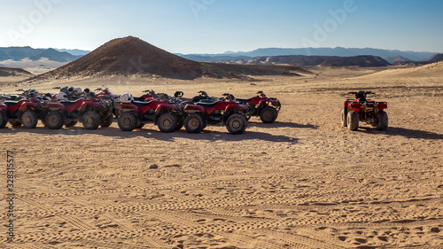  Panorama of mountain landscape in Egypt with quads  no people. Active leisure and adventure in a stone desert - extreme tour or safari for tourists on quad bikes.