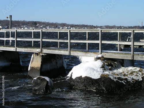 Dock on river with ice and snow