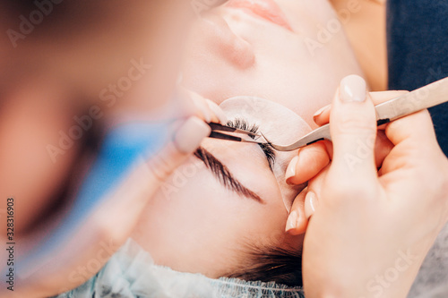 The natural look of eyelash extensions - gluing beams of artificial eyelashes