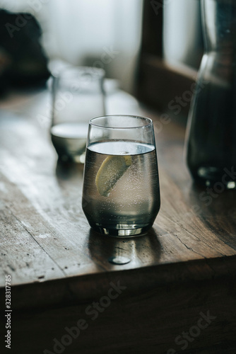 glass of water on wooden table