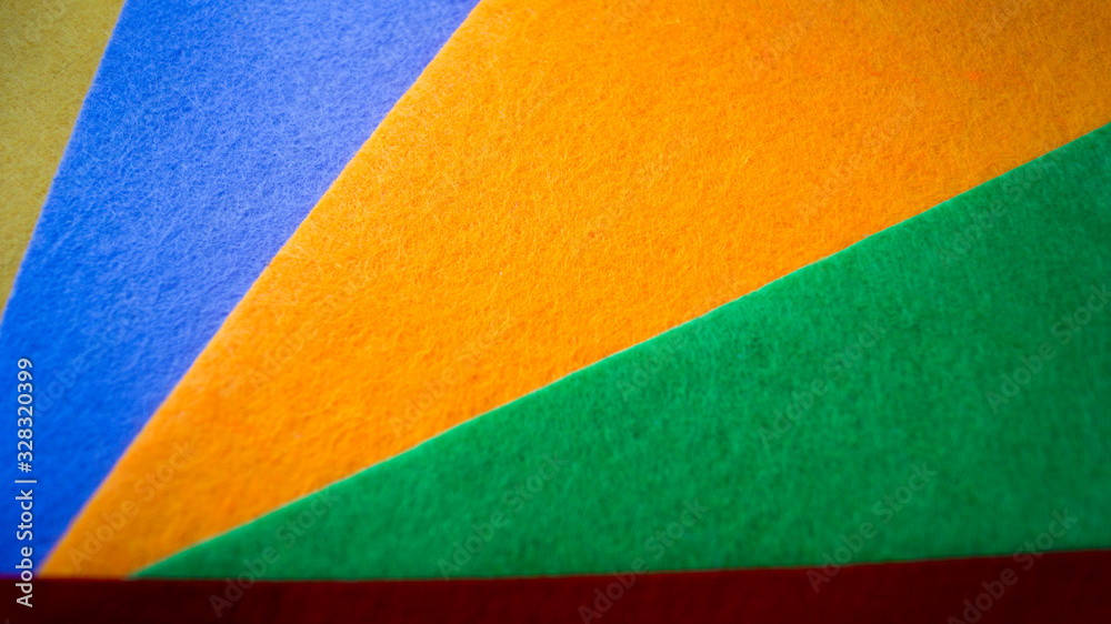 Shreds of colored felt piled on top of each other. Use as background. Material for crafts. Handmade concept. Clothing industry. Shreds of colored felt piled on top of each other. Use as background. Material for crafts. Handmade concept. Clothing industry.
