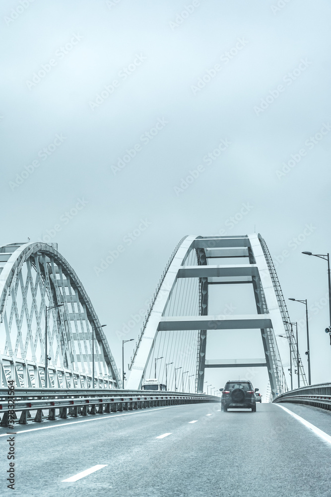 Crimean Bridge. Russia. The Car Goes Through The Arch Of The Crimean ...