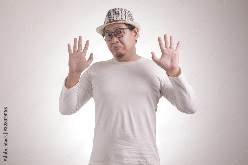 Young Man  Afraid With Arms Raise Up, Surrender Gesture