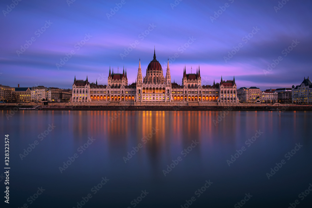 Hungarian Parliament Building in Budapest at sunset with Danube river