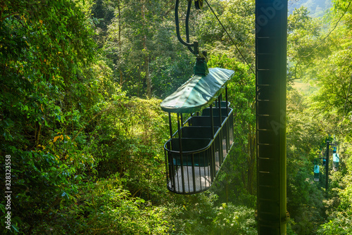 Cable car cabin riding through the tropical rainforest near Jaco in Costa Rica © Nick Fox