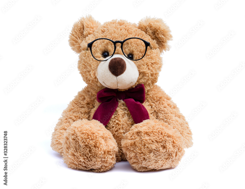 Brown teddy bear with eye glasses isolated on white background. Brown teddy bear with eye glasses isolated on white background.