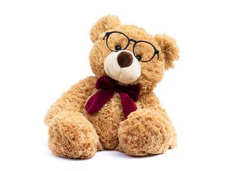 Brown teddy bear with eye glasses  isolated on white background.