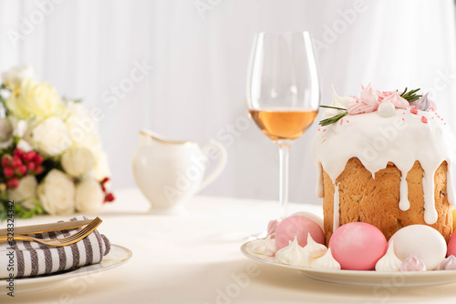 Photography selective focus of delicious Easter cake decorated with meringue with pink and w