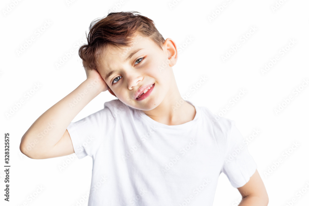 Closeup portrait of sad child with headache holding his head with hand isolated on white background. Worldwide epidemic of coronavirus covid-2019. Health and medical care. Quarantine. Insurance. Closeup portrait of sad child with headache holding his head with hand isolated on white background. Worldwide epidemic of coronavirus covid-2019. Health and medical care. Quarantine. Insurance.