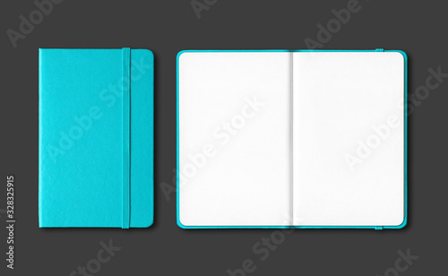 Aqua blue closed and open notebooks isolated on black photo