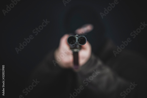 a bandit with a hunting rifle takes aim