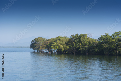 Udawalawe  Sri Lanka dramatic view across a lake.