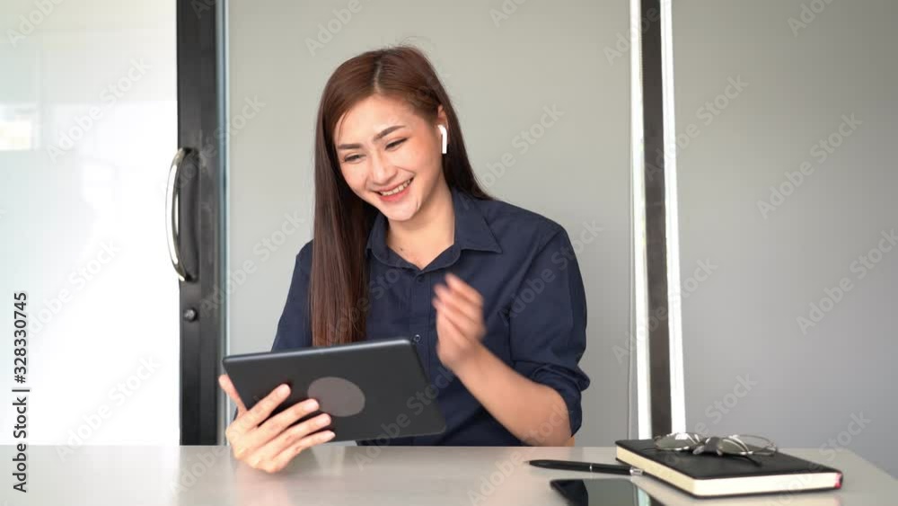 4k video of asien Business women Video Conferencing With Co-worker by Digital tablet in the modern modern office. 4k video of asien Business women Video Conferencing With Co-worker by Digital tablet in the modern modern office.