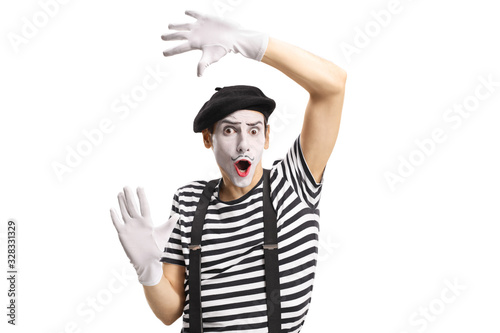 Mime toucing an imaginary wall photo