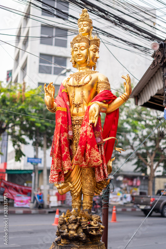 Statue of Brahma Deity of Hinduism  At the Huai Khwang intersection, Bangkok, Thailand photo