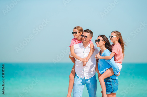 Photo of happy family having fun on the beach. Summer Lifestyle © travnikovstudio