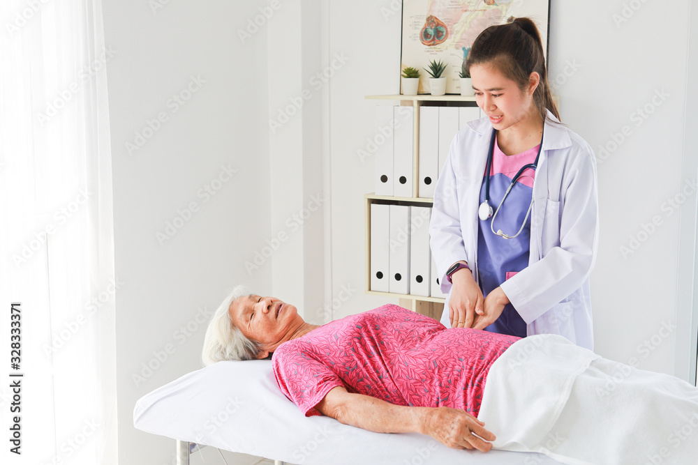 Asian Old Patient woman Talking with Medical Doctor women in clinic office hospital Asian Old Patient woman Talking with Medical Doctor women in clinic office hospital