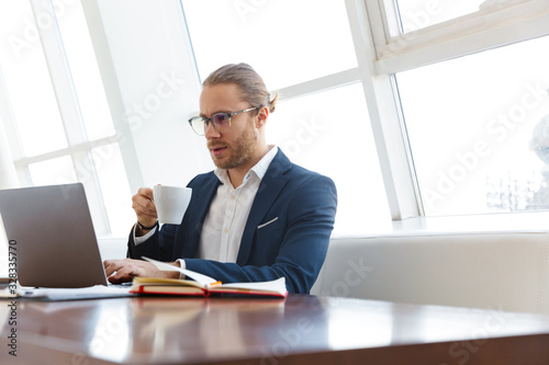 Serious concentrated young businessman