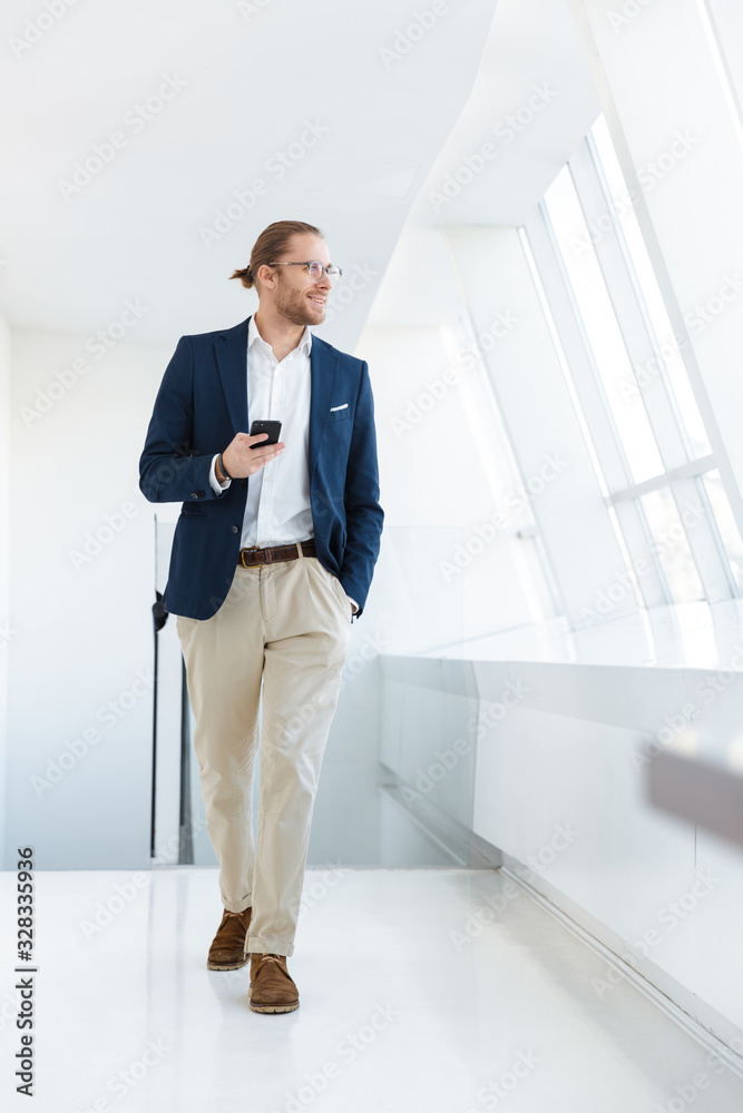 Fototapeta premium Positive pleased young businessman