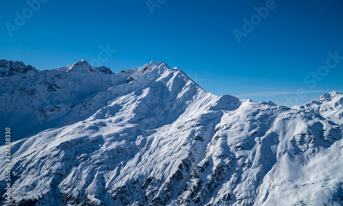 European winter sports Alps - snowy peaks, mountains and ski slopes with blue skies near St. Anton am Arlberg © Jack Krier