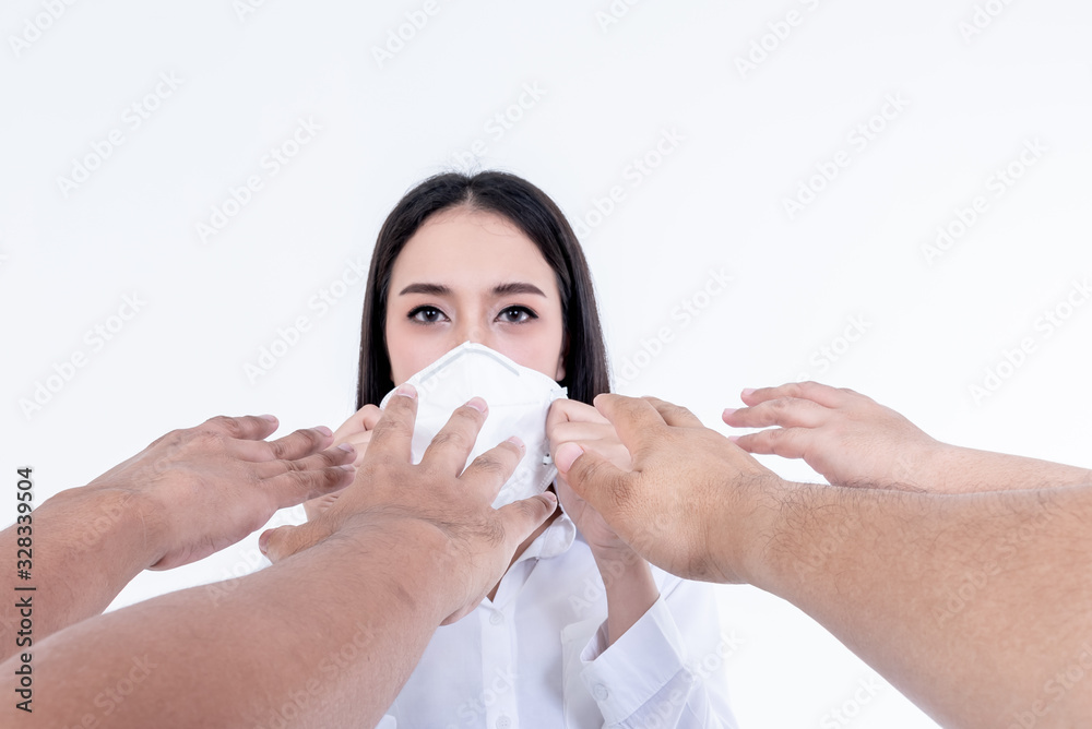 The hands of people extending to Asian pretty women Who was wearing a mask For prevention of germs, flu and COVID-19, On white background, concept to Shortage of medical masks The hands of people extending to Asian pretty women Who was wearing a mask For prevention of germs, flu and COVID-19, On white background, concept to Shortage of medical masks