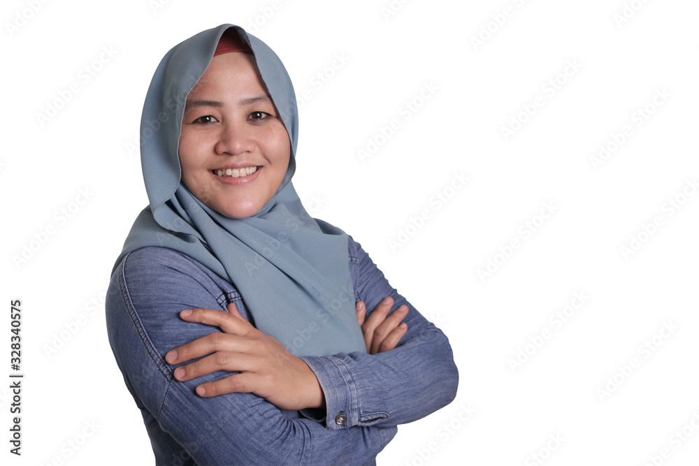 Confident Muslim Lady Smiling Friendly with Crossed Arms Confident Muslim Lady Smiling Friendly with Crossed Arms