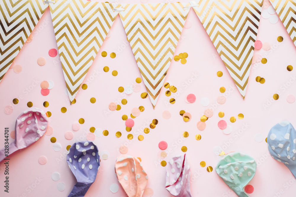 Template for the holidays. Paper garland of flags on a pink background with confetti and air balloons in pastel color. Celebratory background, birthday Template for the holidays. Paper garland of flags on a pink background with confetti and air balloons in pastel color. Celebratory background, birthday