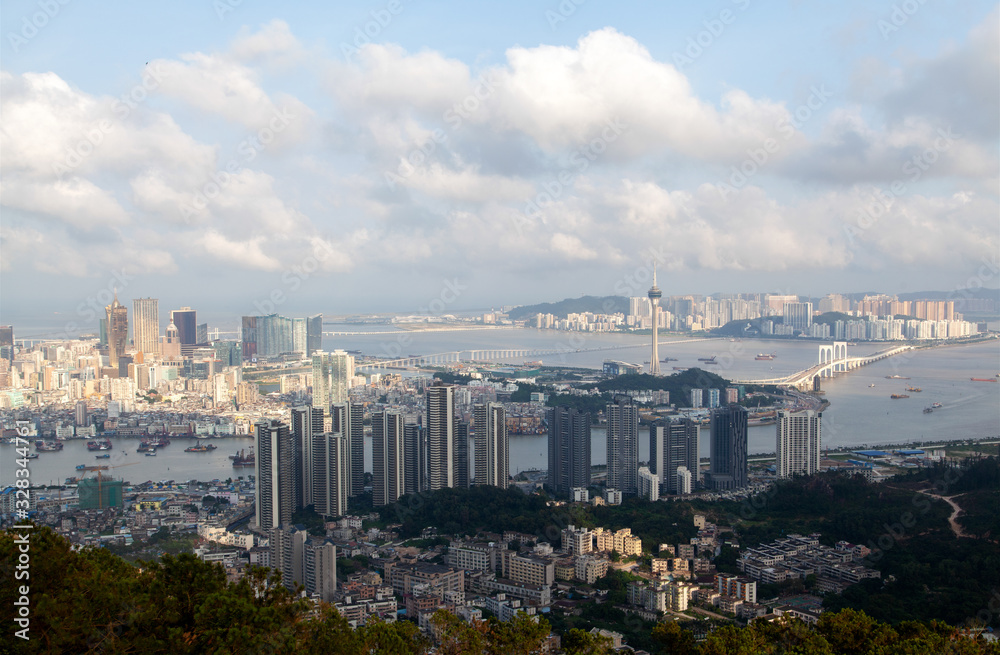 Obraz premium Modern Macau buildings on hilly landscape in China