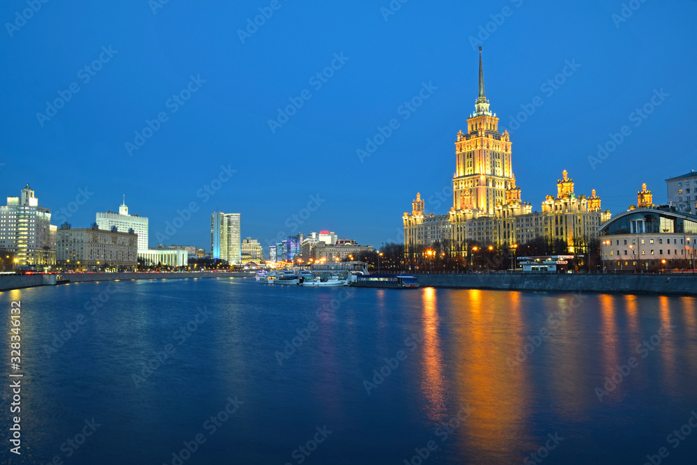 High-rise buildings on the embankment of the Moscow river in the evening. Russia, Moscow, February 2012