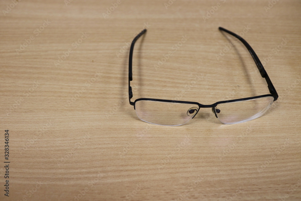 Glasses are on the office desk. Glasses are on the office desk.