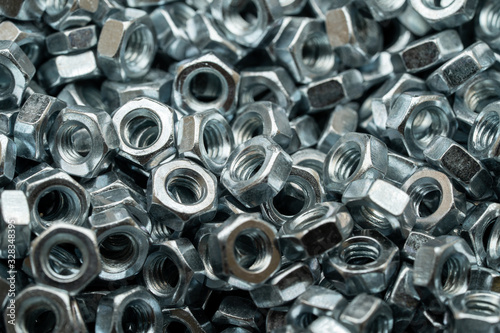 Steel nuts for bolt used in carpentry and handicrafts for industrial and household. © ABCreative