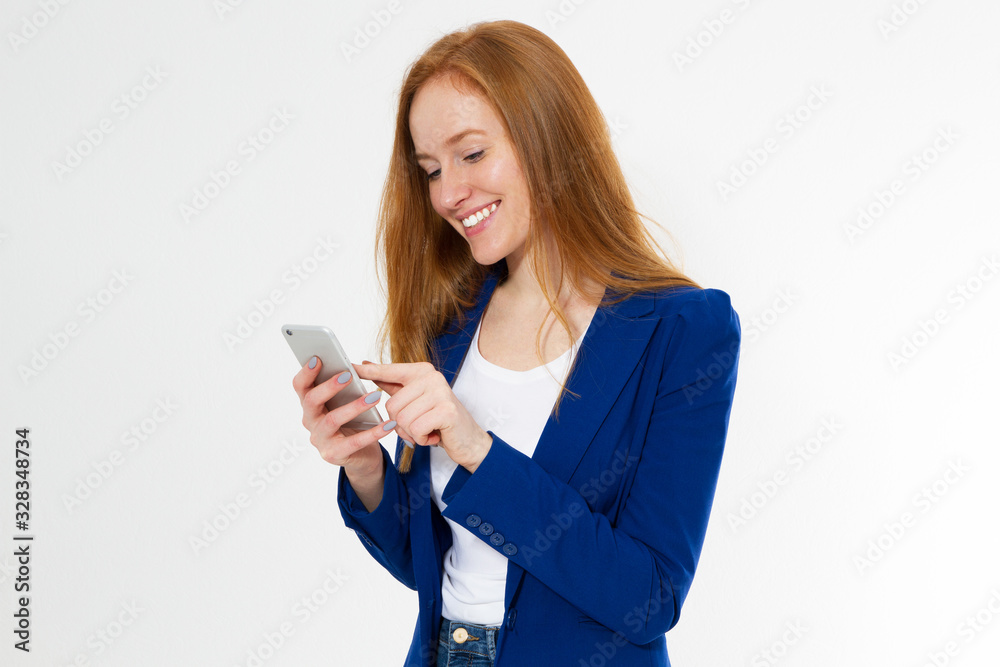 Young red head woman using smart phone copy space portrait Young red head woman using smart phone copy space portrait