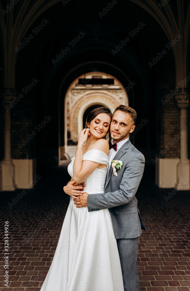 Pretty couple standing in the middle of the corridor tunnel Pretty couple standing in the middle of the corridor tunnel