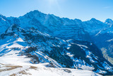 Parnoramic view of snow covered Swiss Alps from Mannlichen mountain in Grindelwald ski resort. Winter in Switzerland