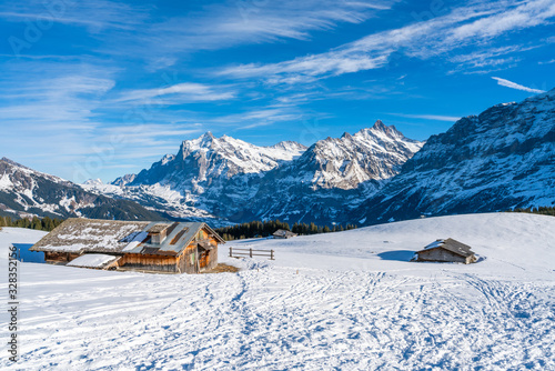 Winter landscape with snow Swiss Alps from Mannlichen mountain in Grindelwald ski resort. Winter in Switzerland
