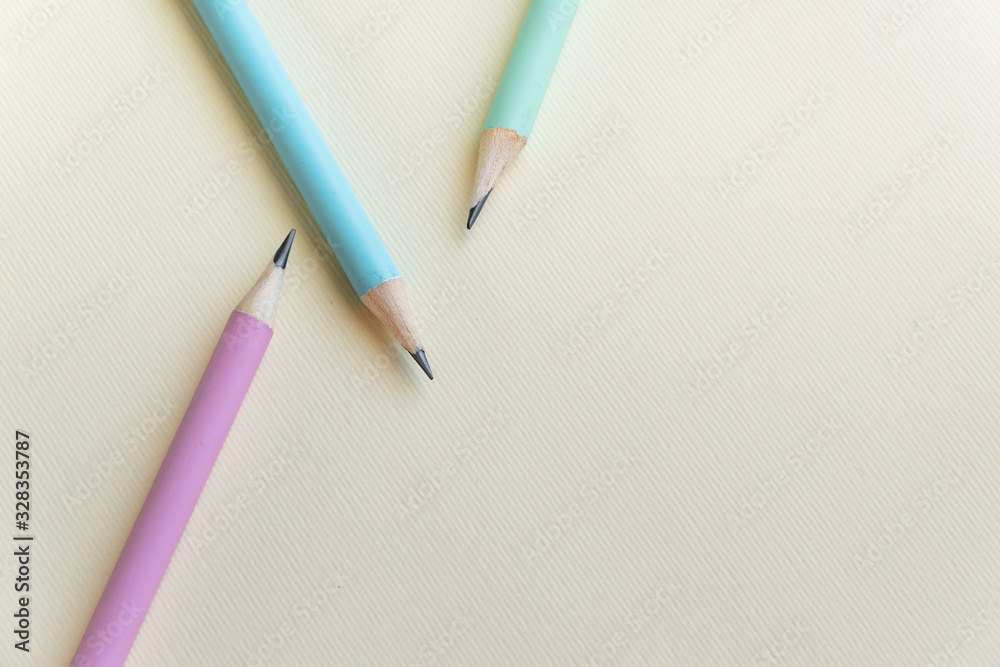 Pastel colored pencils on empty sheet Pastel colored pencils on empty sheet