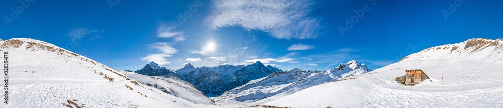 Obraz premium 360 degree wide parnoramic view of snow covered Swiss Alps from First mountain in Grindelwald ski resort, Switzerland
