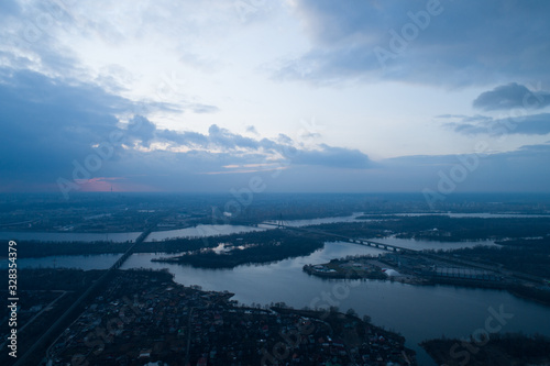 Beautiful panoramic aerial view of the Dnieper River and the North Bridge or Moscow Bridge from the left bank. © LALSSTOCK