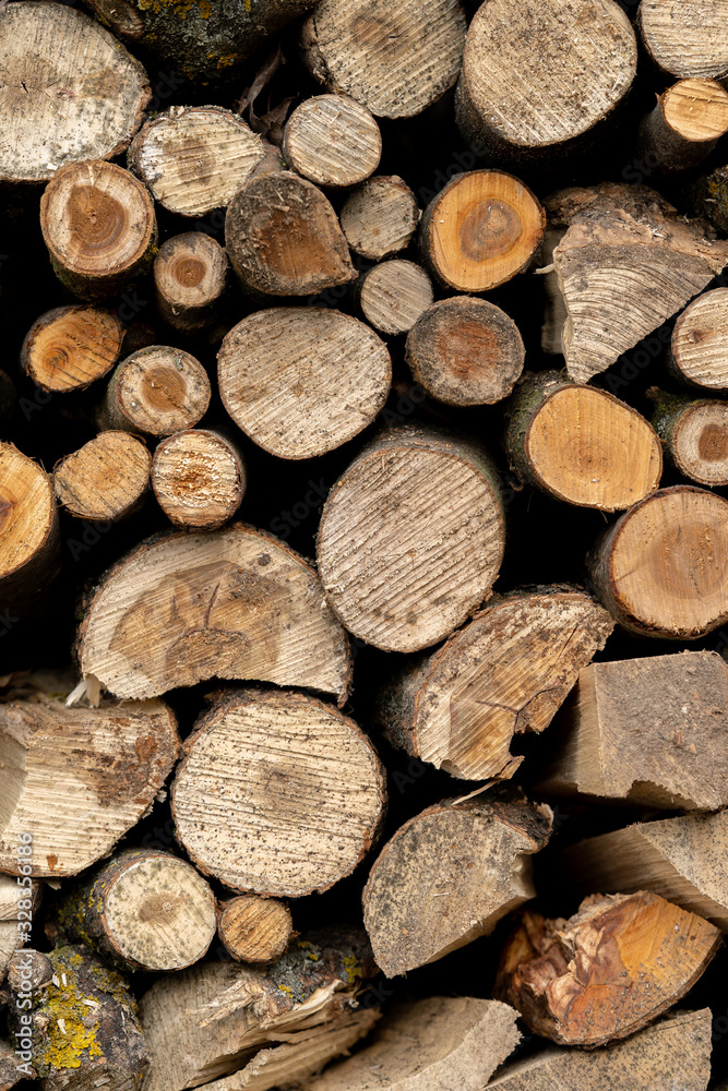 Cut wood lying on the stack. Background composed of chopped wood. Cut wood lying on the stack. Background composed of chopped wood.