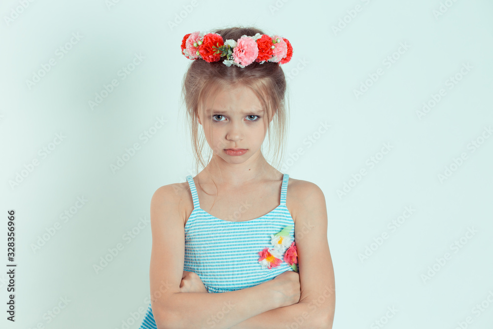 Sad girl looking at camera with arms crossed, folded hands Sad girl looking at camera with arms crossed, folded hands