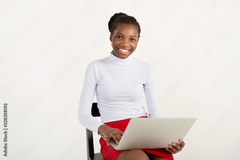 beautiful young african woman on white background with laptop beautiful young african woman on white background with laptop
