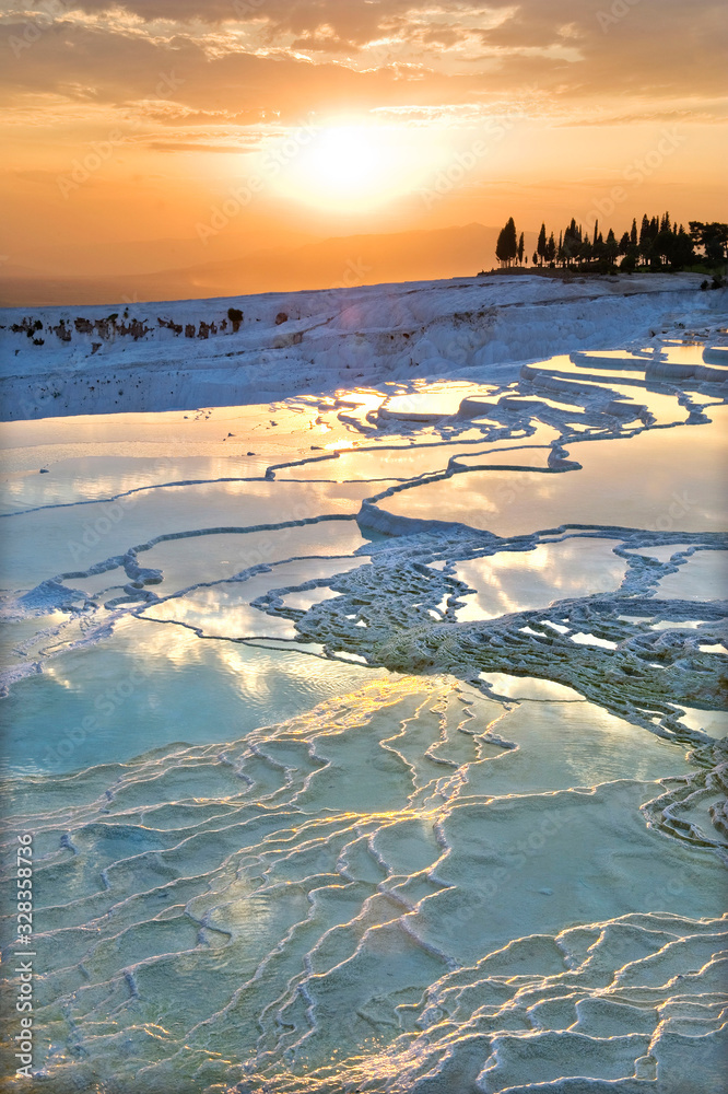Carbonate travertines the natural pools during sunset, Pamukkale, Turkey - UNESCO HERITAGE