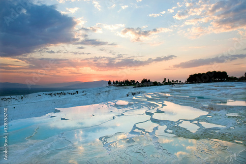 Carbonate travertines the natural pools during sunset, Pamukkale, Turkey
