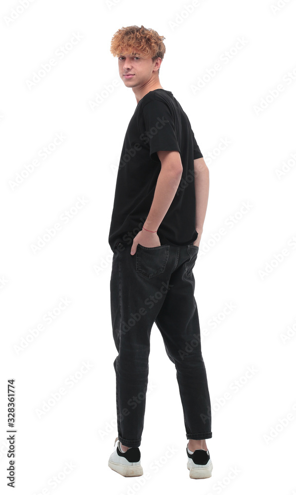 Fototapeta premium rear view. a man in a black t-shirt looking at the camera