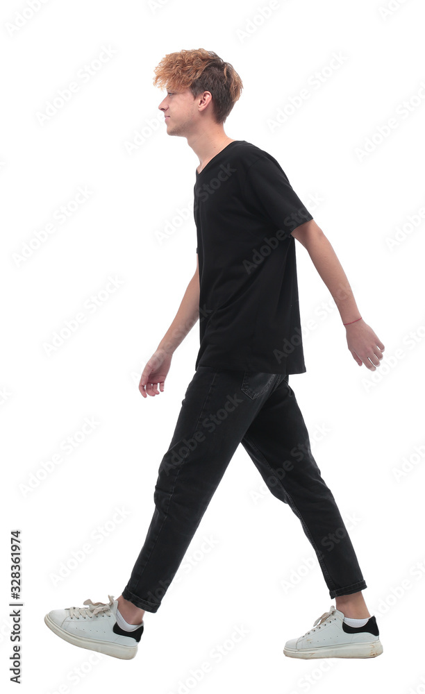 side view. stylish young man confidently moving forward side view. stylish young man confidently moving forward