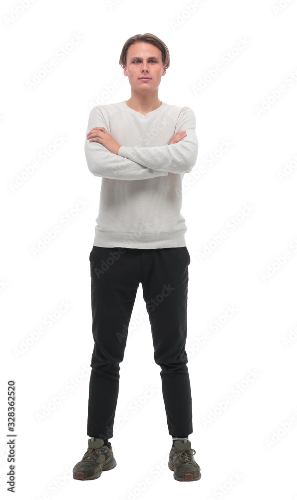 in full growth. stylish young man in white longsleeve. in full growth. stylish young man in white longsleeve.