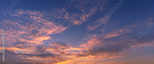 beautiful cloudscape at sunset with red clouds © mimadeo